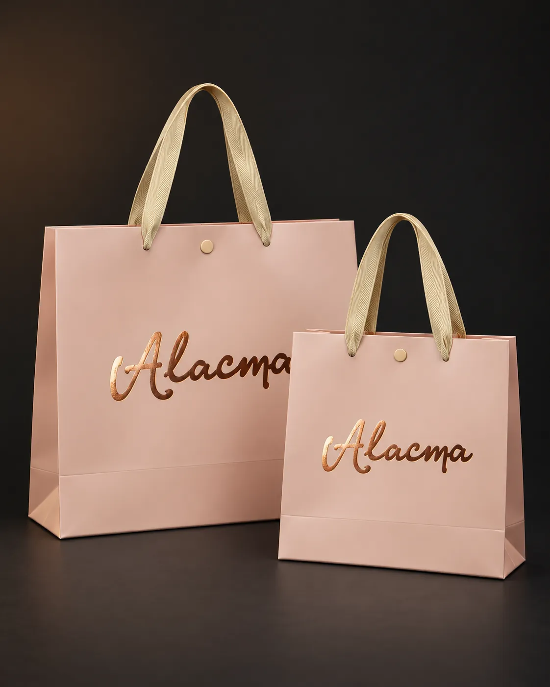 Duas sacolas de papel rosé personalizadas Alacma com alça de gorgurão